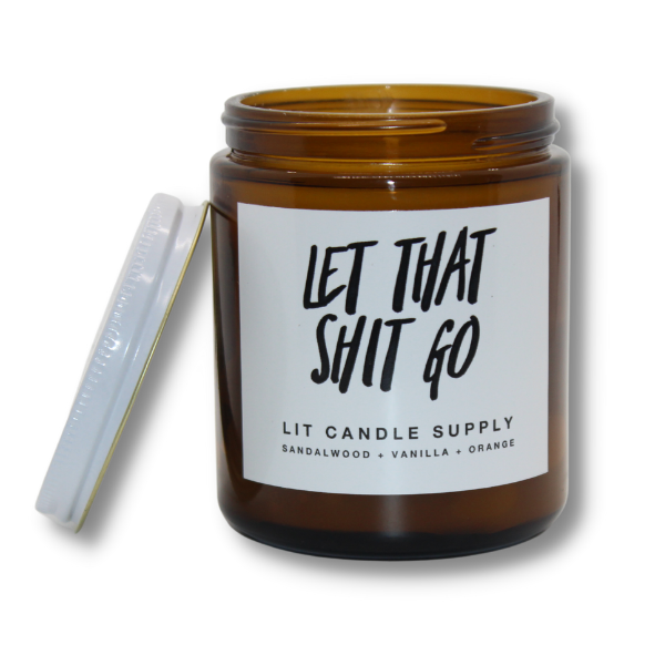 LIT CANDLE SUPPLY Let That Go Candle open with lid off.