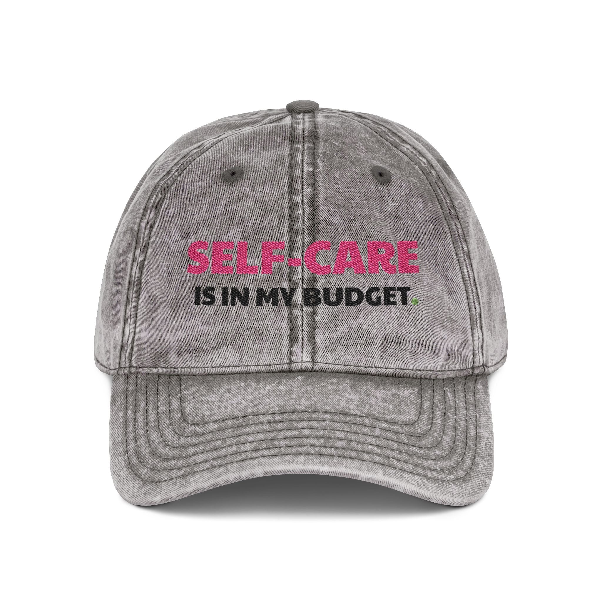 Gray cap with 'Self-care is in my budget' text on a white background
